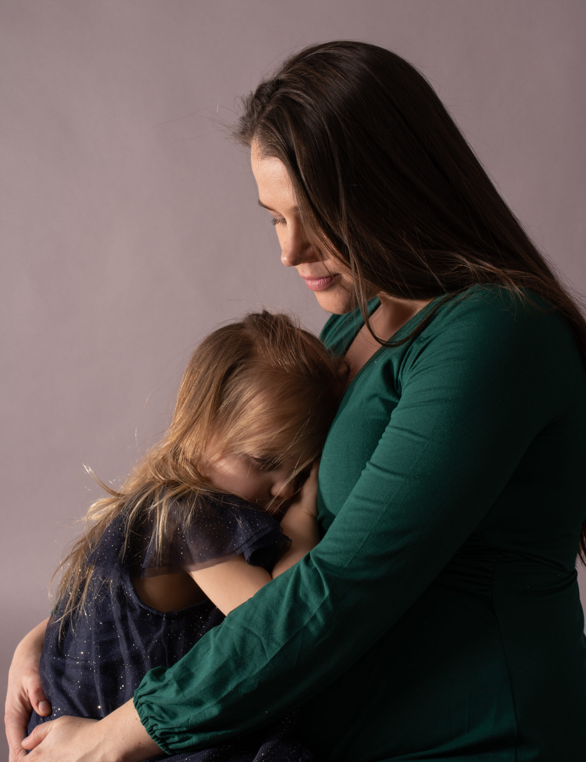 a woman holding a child