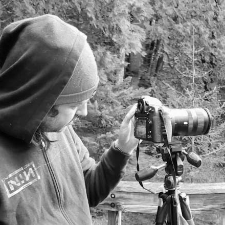 a man taking a picture of himself with a camera