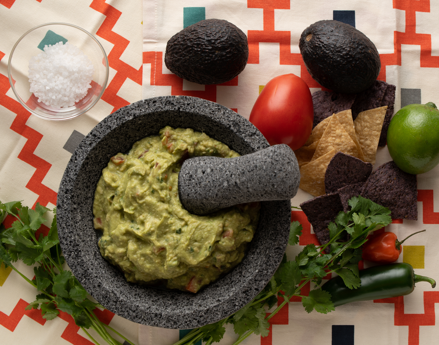 a mortar with a pestle and ingredients