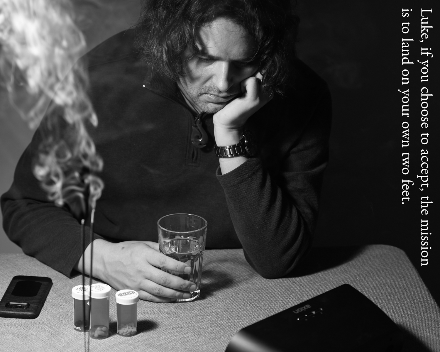 a man holding a glass of water